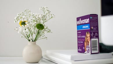 white flowers in white ceramic vase